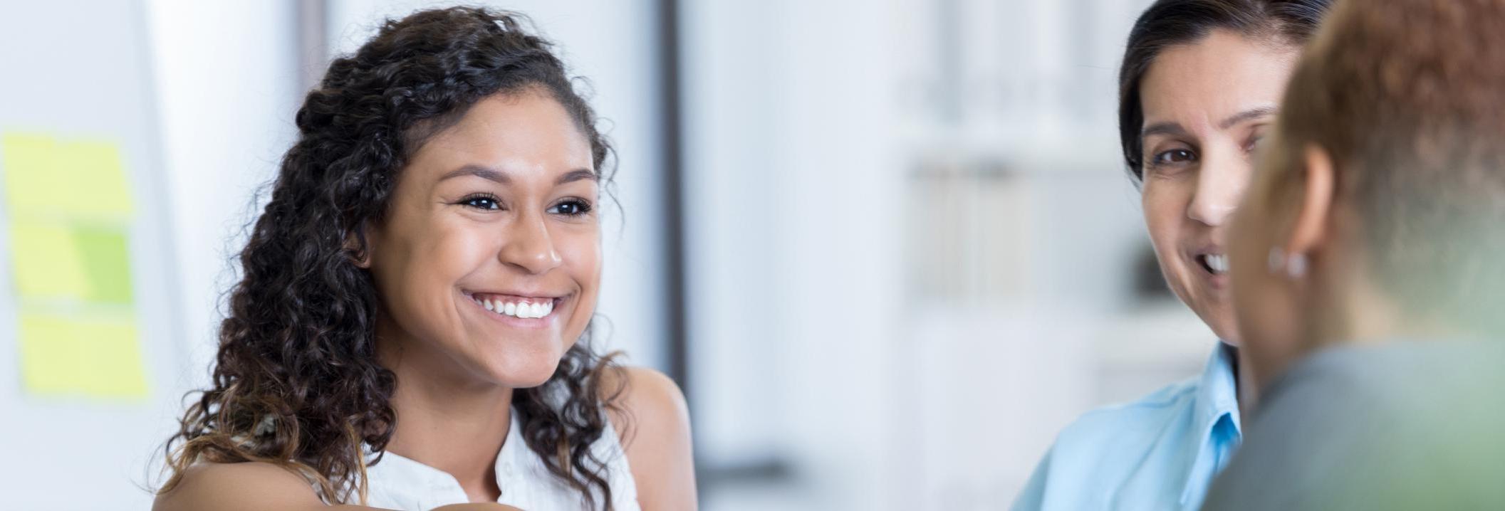 latino woman shaking hands in partnership